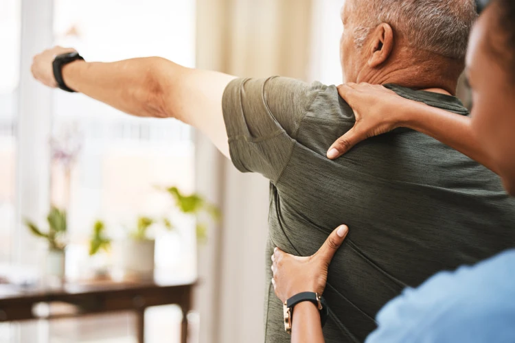 a man at an appointment with a chiropractor