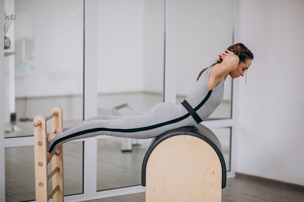 a woman is doing exercises for flexibility of the back