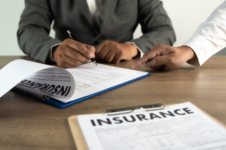 Workers Comp Insurance on the table