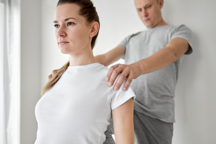 a chiropractor adjusts posture